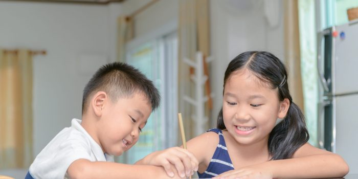 sister and brother paint color on paper by pencil, education concept